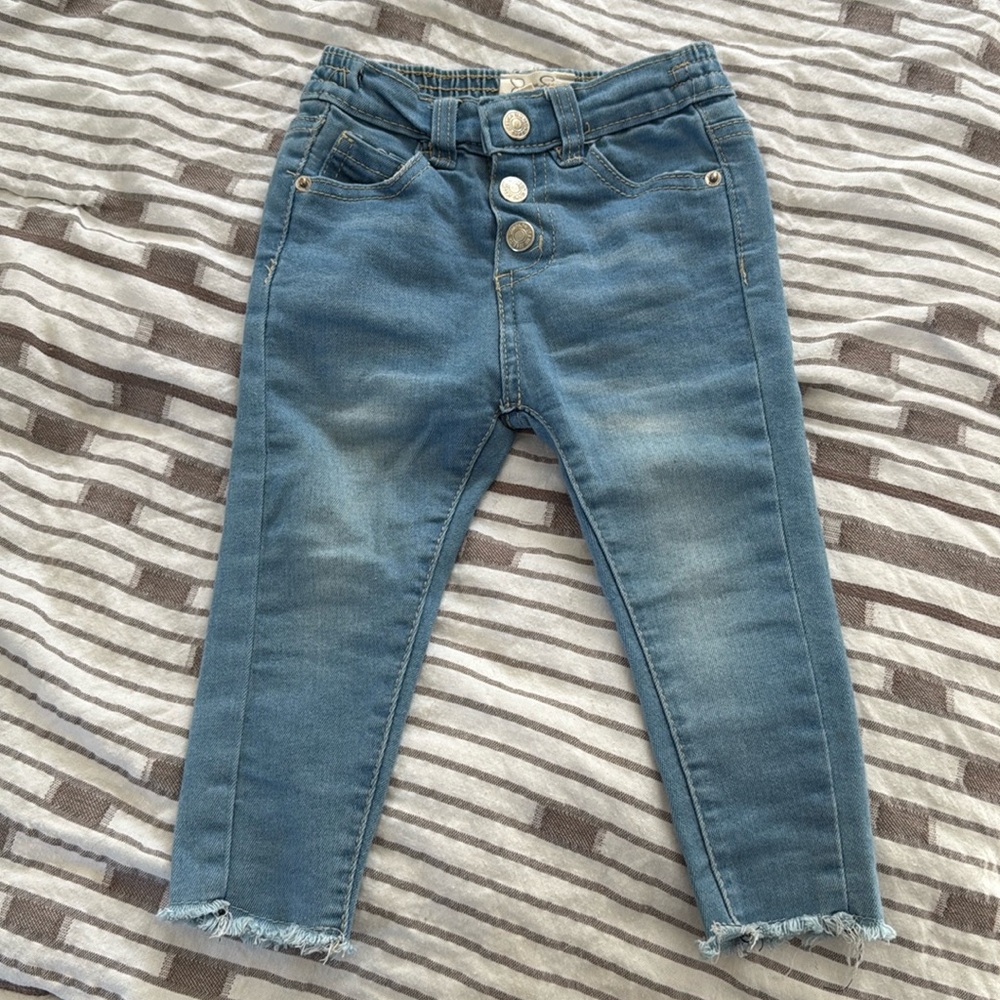 Jessica Simpson straight leg jeans with frayed bottoms.